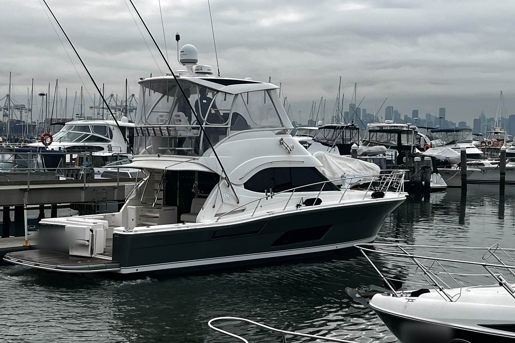 A flybridge motor yacht at a Williamstown marina