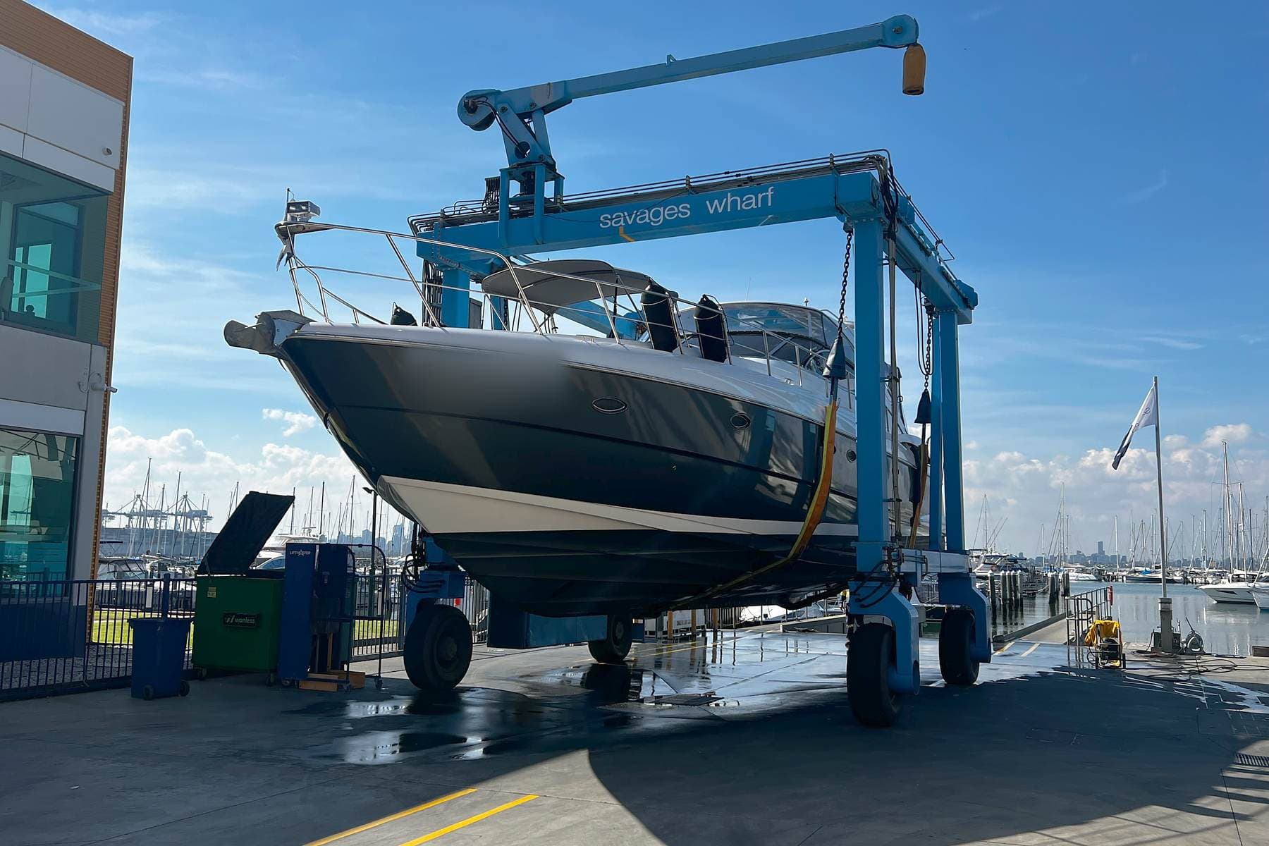 A motor cruiser in the travel lift at Savage’s Wharf, Williamstown
